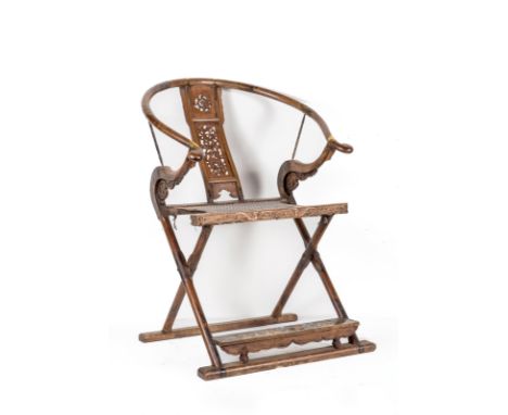 A hardwood folding armchair with horseshoe shaped backChina, Qing dynasty, 19th century . . Cm 72,00 x 103,00 x 62,00. A simi
