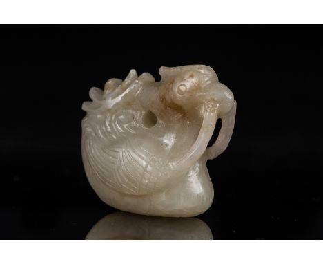A jade pendant shaped as a duck China, 19th century . . Cm 3,00 x 3,00.