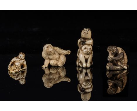 Two netsuke and two ivory okimono Japan, 19th century. . Cm 5,50.