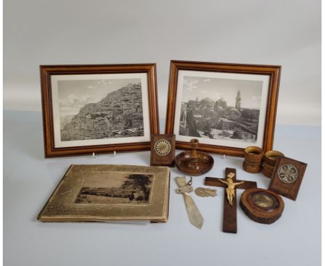 A collection of souvenir items from the Holy Land and Jerusalem, including an album of photographs and pressed flowers, two f
