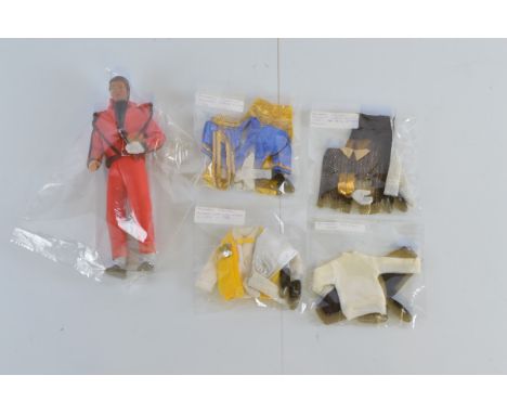 A Michael Jackson Thriller action figure, with various associated clothing