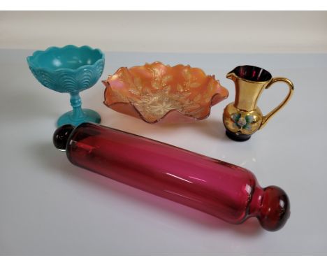 A collection of glassware, including a silver plated decanter claret jug with glass reservoir and cut body, a cranberry glass