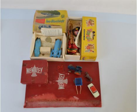 A mixed lot of toys, including a Peham Puppet, Donald Campbell Two Bluebirds set, Wembley board games, loose diecast, etc.