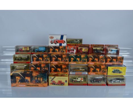 A quantity of boxed Matchbox models, including Matchbox Models of Yesteryear Fire Engine Series, Dinky Collection, etc (26)
