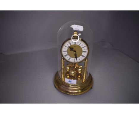 A glass domed anniversary clock K.U.S Germany