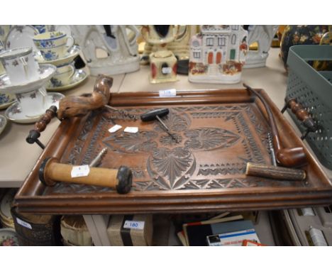 A selection of treen including carved tray, pipe, and corkscrew including horn handled example.