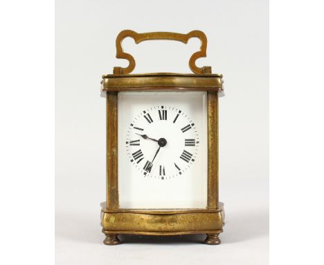 A FRENCH BRASS SERPENTINE FRONT CARRIAGE CLOCK. 4.5ins high.