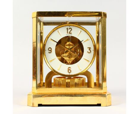 A JAEGER-LECOULTRE ATMOS CLOCK, with white circular chapter ring. 9.25ins high.