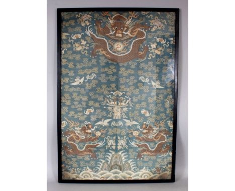 A GOOD 19TH CENTURY FRAMED CHINESE KESI BLUE GROUND SILK DRAGON PANEL, decorated with dragons, bats, cranes and cloud scrolls