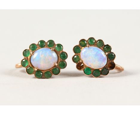 A PAIR OF GOLD OPAL SET EAR CLIPS.