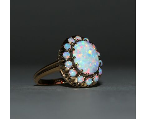 A GOOD 9CT GOLD GILSON OPAL CLUSTER RING.