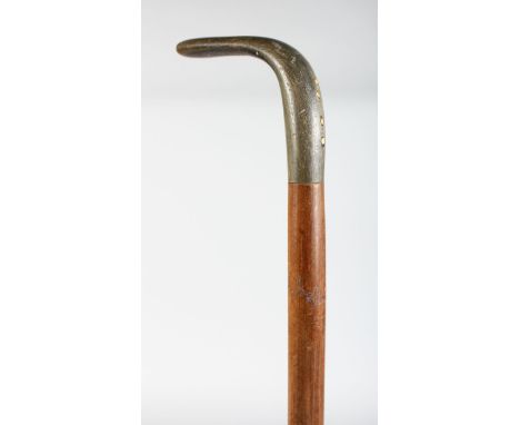 A WALKING STICK WITH RHINO HANDLE.