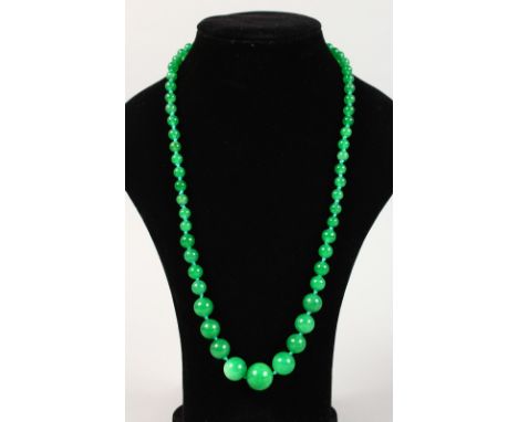 A GOLD MOUNTED JADE NECKLACE.