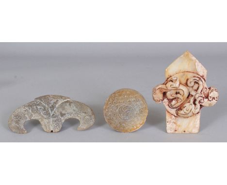 A GROUP OF THREE ARCHAIC STYLE JADE-LIKE CARVINGS, the largest 4in x 3.1in. (3)
