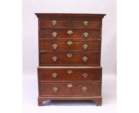 A GEORGE III OAK TALLBOY, with a moulded cornice, two short and five graduated long drawers, all with pierced brass handles a