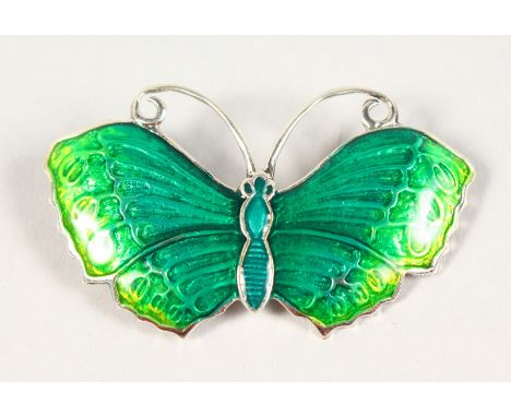 A SILVER AND GREEN ENAMEL BUTTERFLY BROOCH.