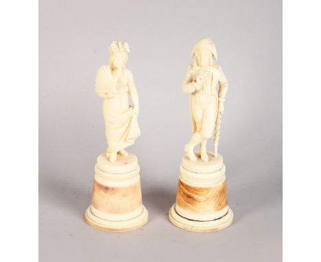 A GOOD PAIR OF 19TH CENTURY FRENCH IVORY FIGURES OF A GALLANT AND LADY, the man with walking stick, the woman holding a fan, 