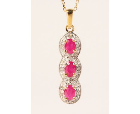 A 9CT GOLD, RUBY AND DIAMOND PENDANT AND CHAIN.