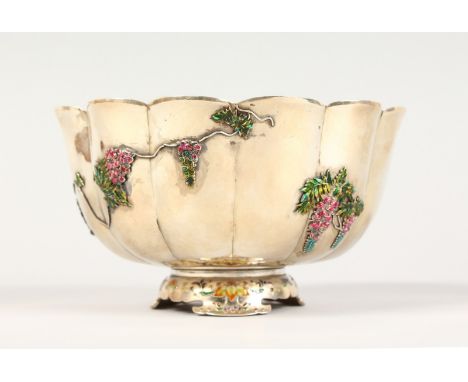 A CHINESE SILVER AND ENAMEL DECORATED PEDESTAL BOWL, of lobed form, floral enamel decoration, signed. 6ins diameter.