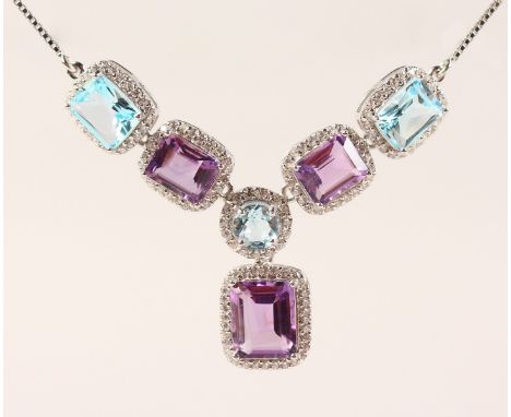 A SILVER, BLUE TOPAZ AND AMETHYST NECKLACE.