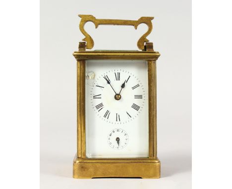 A FRENCH BRASS CARRIAGE CLOCK. 5ins high.