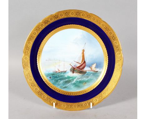 A VERY FINE QUALITY MINTON PLATE, painted with a seascape of Dover Castle, under a blue and richly gilt border, especially ma