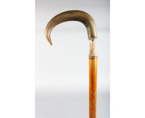 A WALKING STICK WITH RHINO HANDLE.