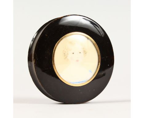A GOOD VICTORIAN TORTOISESHELL CIRCULAR BOX, the lid with a portrait of a young girl. 3.5ins diameter.