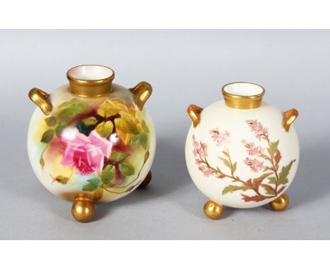 A ROYAL WORCESTER SPHERICAL TWO-HANDLED VASE on three feet painted with roses c.1912 and a similar ivory ground vase smaller 