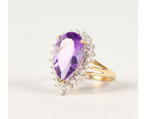 A 9CT GOLD, PEAR SHAPE AMETHYST AND DIAMOND RING.