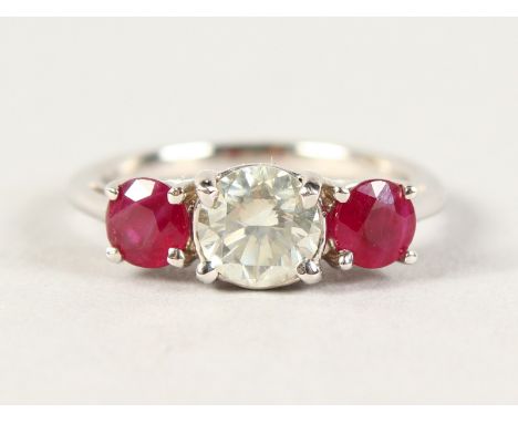 AN 18CT THREE STONE RUBY AND DIAMOND RING of 1.6cts approx.