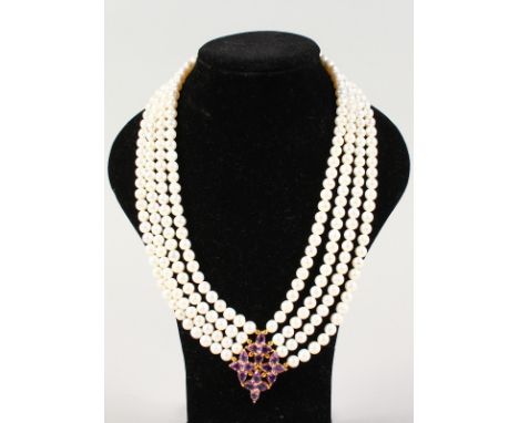 A FOUR-ROW PEARL NECKLACE, with silver gilt and amethyst clasp.