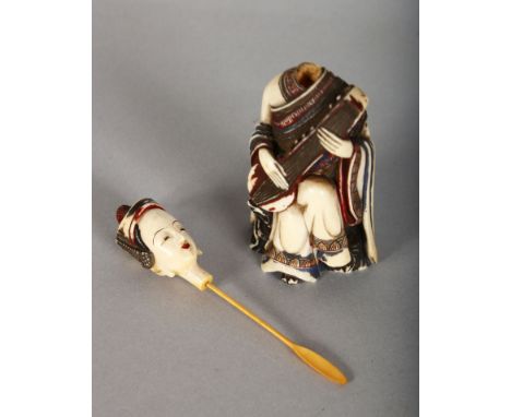 A CHINESE CARVED IVORY SNUFF BOTTLE, a seated woman with a musical instrument, with detachable head. 4.5ins high.