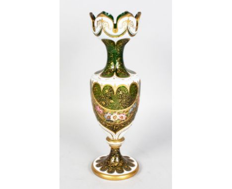 A BOHEMIAN TALL SLENDER WHITE OVERLAY, RUBY AND GILT VASE painted with garlands of flowers. 13ins high.