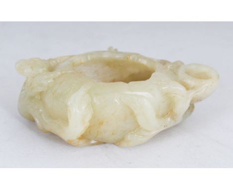 A SMALL CHINESE CARVED JADE BRUSH WASHER of naturalistic form. 3.5ins wide.