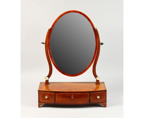 AN EDWARDIAN MAHOGANY TOILET MIRROR, with oval mirror, three drawers to the bowfronted base, on bracket feet. 1ft 10ins high 