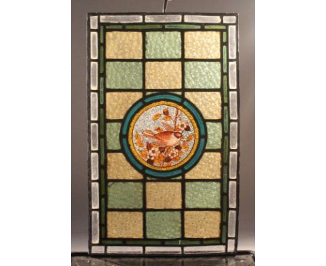 A LATE 19TH CENTURY STAINED GLASS WINDOW PANEL, the central circular panel decorated with a bird on a branch. 2ft 3.5ins high