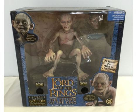 A boxed Lord of the Rings electronic talking Gollum with interchangable Smeagol head from 'The Return of the King'.