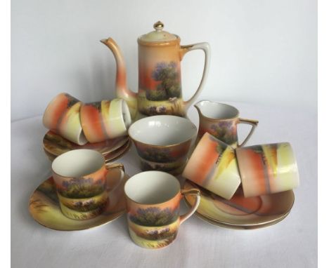 A Noritake coffee set with grazing sheep decoration, comprising; 6 coffee cups & saucers, cream jug, sugar bowl and coffee po