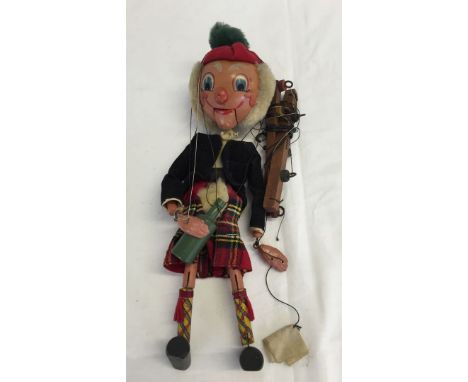 Pelham Puppet Macboozle with red tartan kilt and green bottle. Boxed, in good condition.