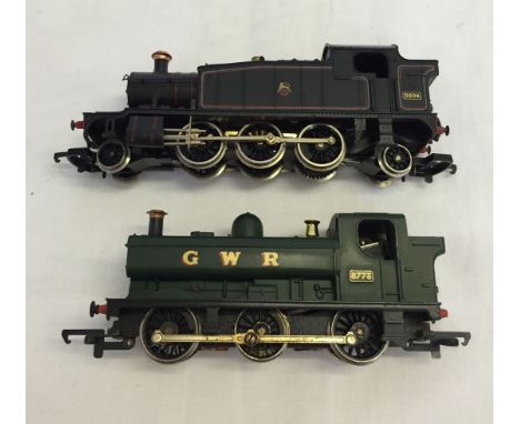 An unboxed Lima OO gauge 5574 2-6-2 locomotive together with a GWR 0-6-0 tank locomotive.