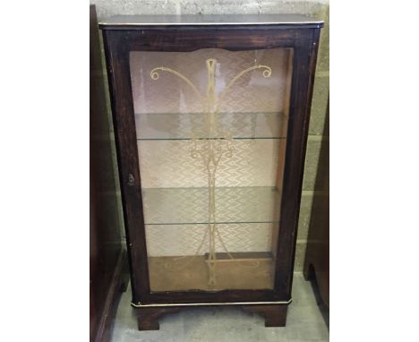 A 2 shelf glass fronted display cabinet with gilt painted decoration to glass.