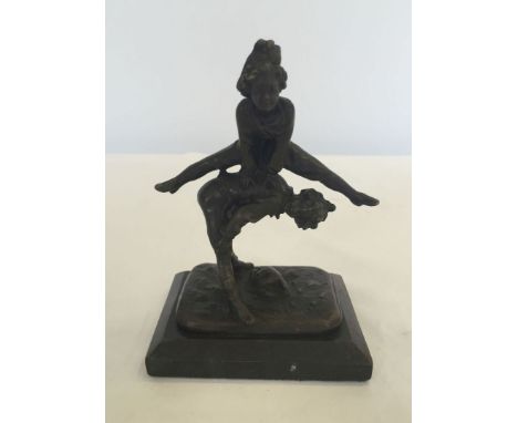 A small bronze ornament on a square marble base depicting children playing leapfrog. Approx 13cm high.