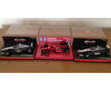 3 boxed Paul's Model Art Minichamps Formula 1 racing cars 1:43 scale. 1) McLaren MP4/13 M. Hakkinen. 2) McLaren MP4/14 M. Hak