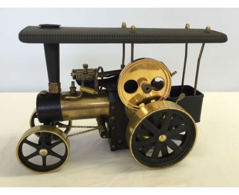 A Wilesco brass "Tranktor" live steam engine.