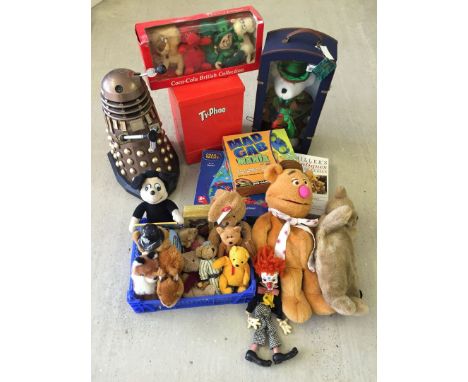 A quantity of mixed toys to include a vintage wind up musical dog, Pelham clown puppet, Dalek and games.