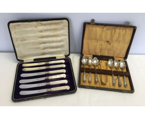 A cased set of 6 silver butter knives with mother of pearl handles, hallmarked Sheffield 1908, together with a cased set of 6