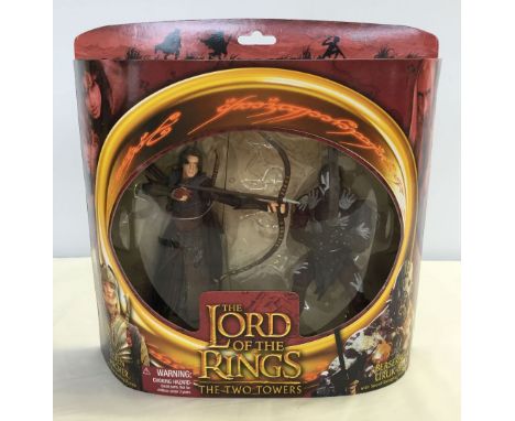 A boxed Lord of the Rings twin playset - Elven Archer & Berserker Uruk-Hai from 'The Two Towers'.