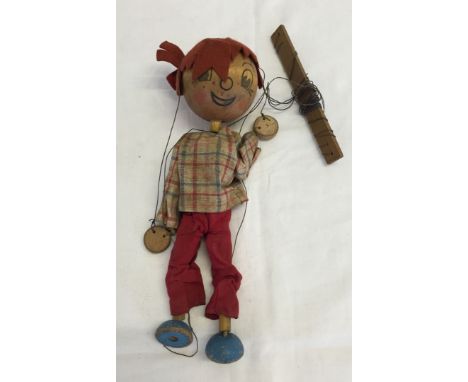 A wooden top Boy Pelham Puppet. Unboxed in playworn condition.