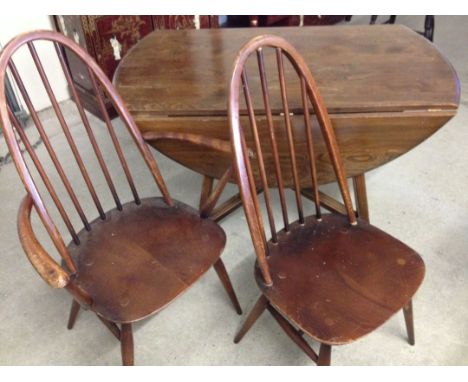 An Ercol drop leaf table with 2 Ercol chairs.